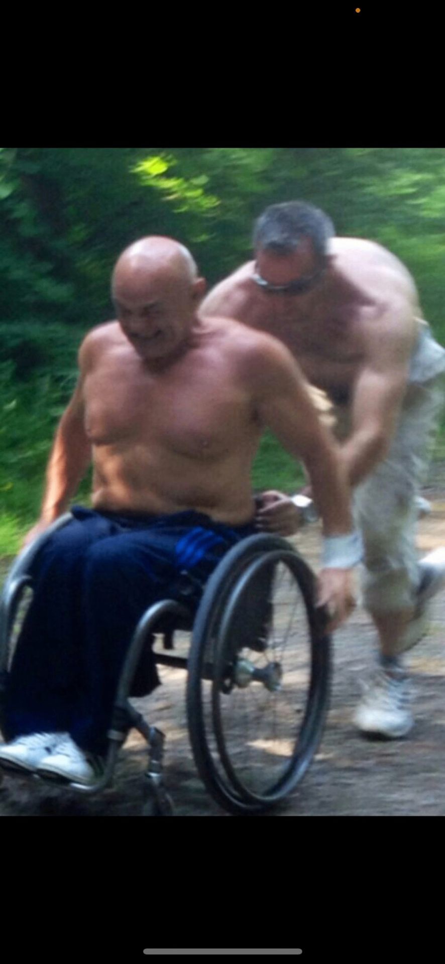 Endurance philanthropy — Mark John Eckley pushing John Harris up Kilimanjaro